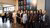 Female professors in front of the portrait gallery Professors Represented