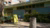 The ‘Cultuurwerkplaats Tarwewijk’ community centre, featuring a yellow A-board and some bushes.