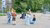 Six children are standing in a circle in a playground in the Reyeroord neighbourhood of Rotterdam, their faces covered by emoji icons.