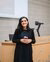 Associate professor Federica Violi poses with a cup of coffee.