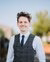 Young man posing for camera in a suit