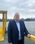 Portrait photo of Erasmus Professor Frank van Oort by the Maas.