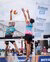 Tom Sonneville blocks the ball during a volleyball match.