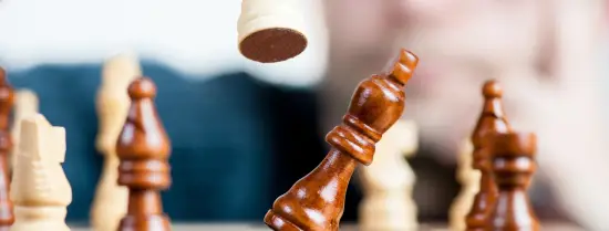 Chess board with chess piece being pawned