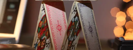 Playing cards stacked as a pyramid