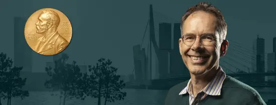 Promotional header image of Guido Imbens with the skyline of Rotterdam as background