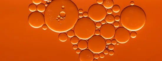 Transparent bubbles on orange background