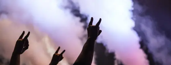People holding up their hands during a concert