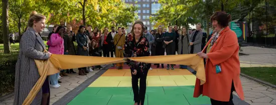 Opening ceremony rainbow path on campus by cutting through a golden ribbon