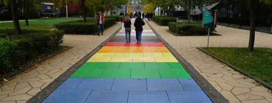 People walking on the rainbow path on campus Woudestein