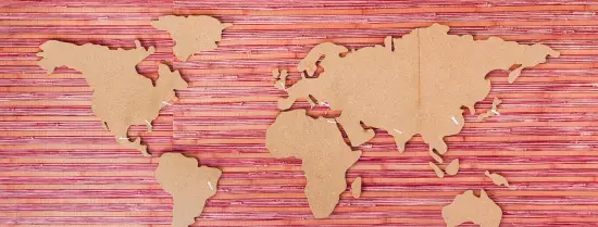 A map of the world, cut out of cardboard