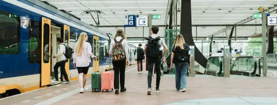 Four students taking the train for studying abroad