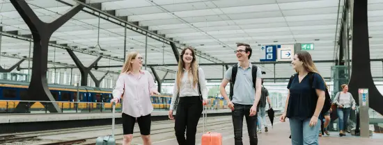 students walking on a train station