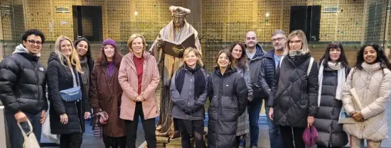 Representatives of IDEA-net in front of a statue of Erasmus at the Erasmus Building at campus Woudestein in Rotterdam
