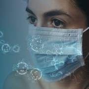 Woman with facemask and corona virus
